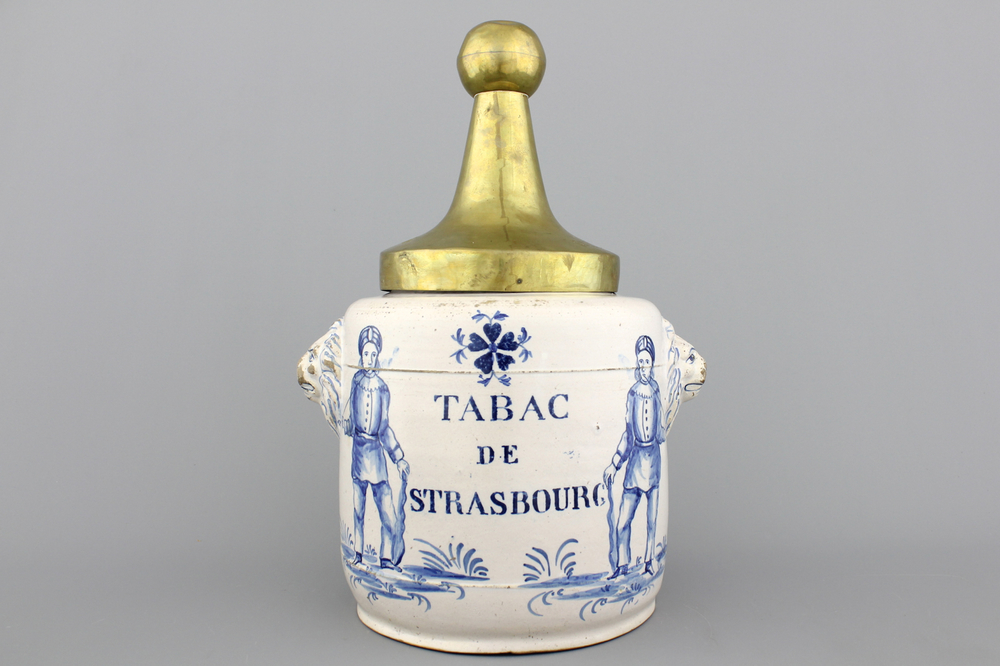 A Brussels Delftware tobacco jar with pipesmokers, 18th C.