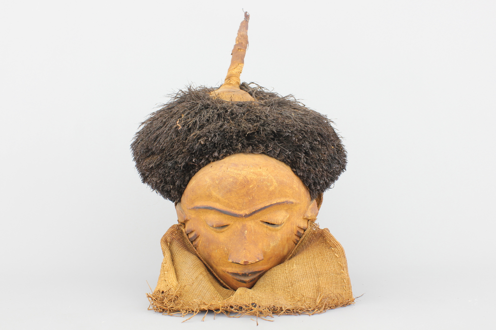 An African carved and painted Pende mask, early to mid 20th C.