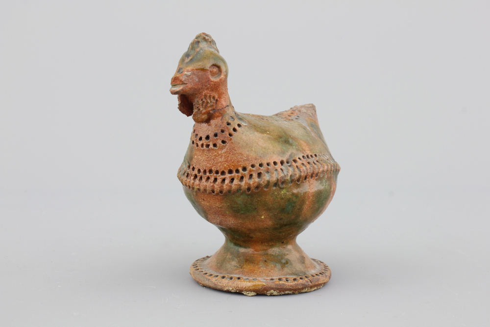 A green-glazed terra cotta cockerel-shaped money bank, probably French, 18th C.