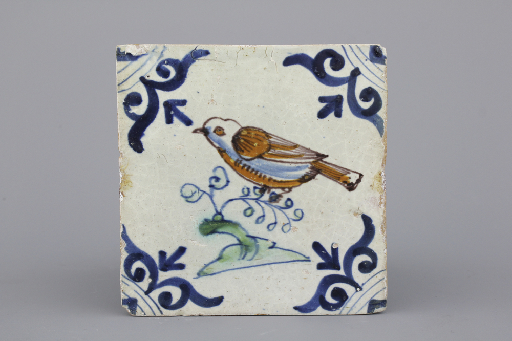 A polychrome Dutch Delft tile with a bird, 17th C.