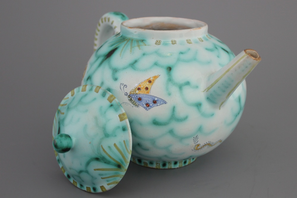 A rare Brussels faience teapot and cover with butterflies, 18th C.