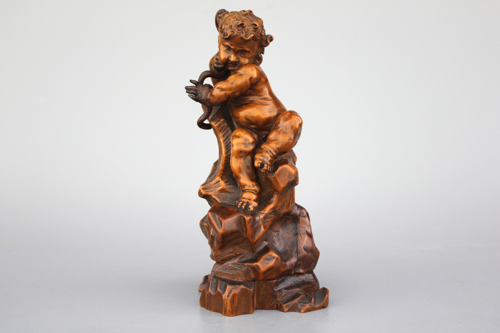 A carved boxwood figure of Hercules with a snake, ca. 1620