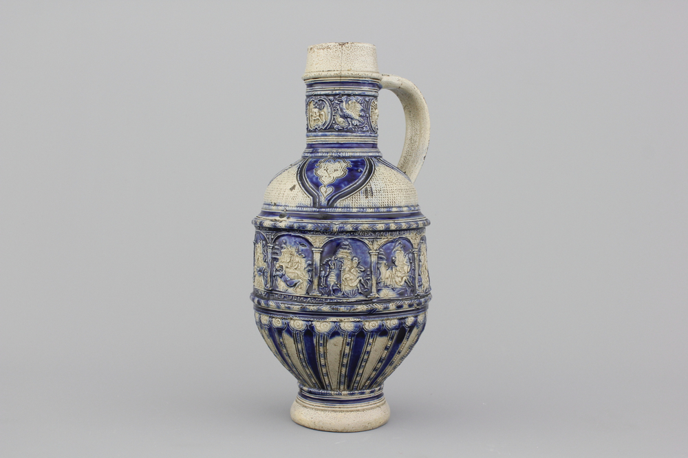 A Westerwald jug, decorated with historical panels, early 17th C.