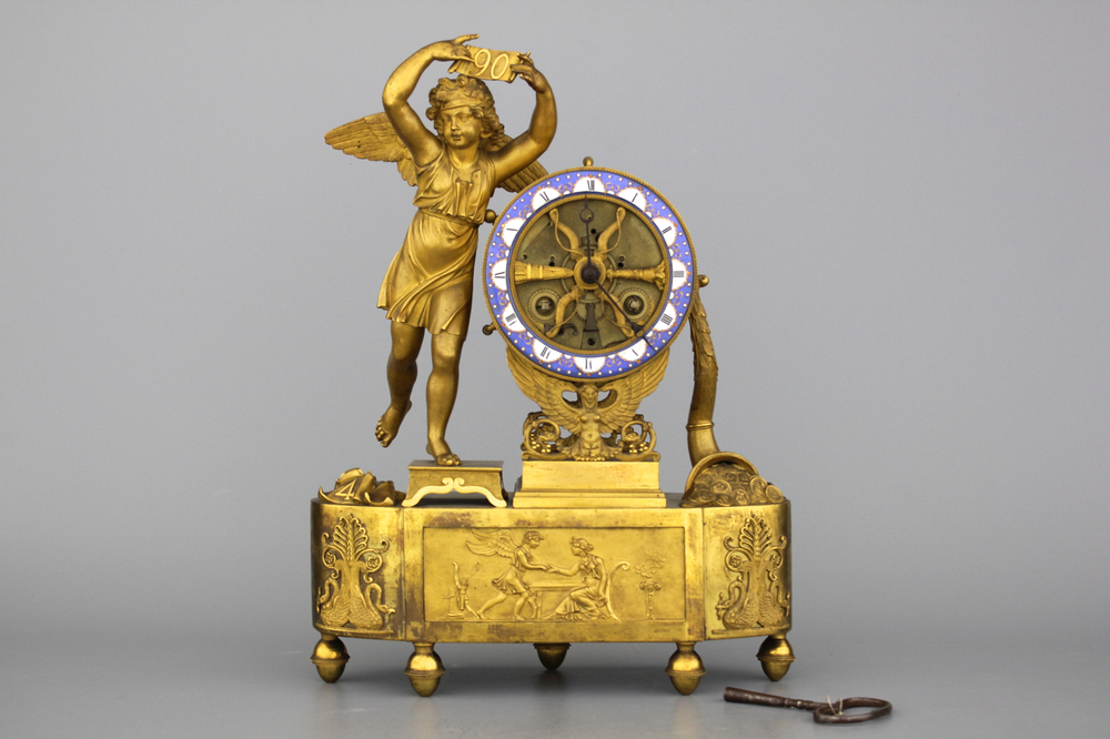 A French Empire gilt bronze and enamel skeleton pendule depicting Cupid early 19th C.