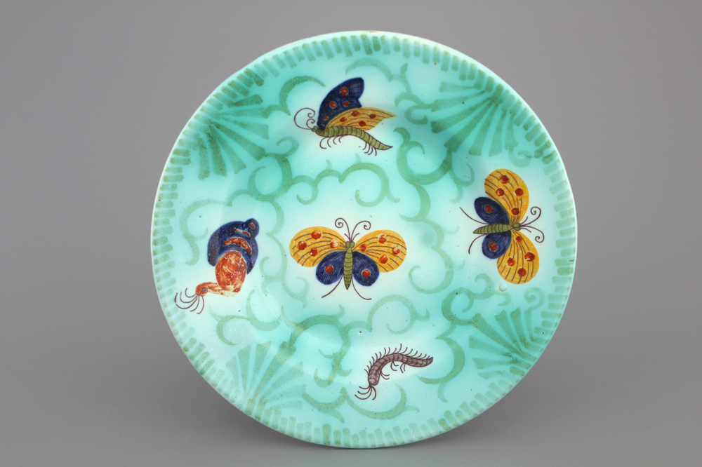 A Brussels faience round butterfly decor plate, 18th C.