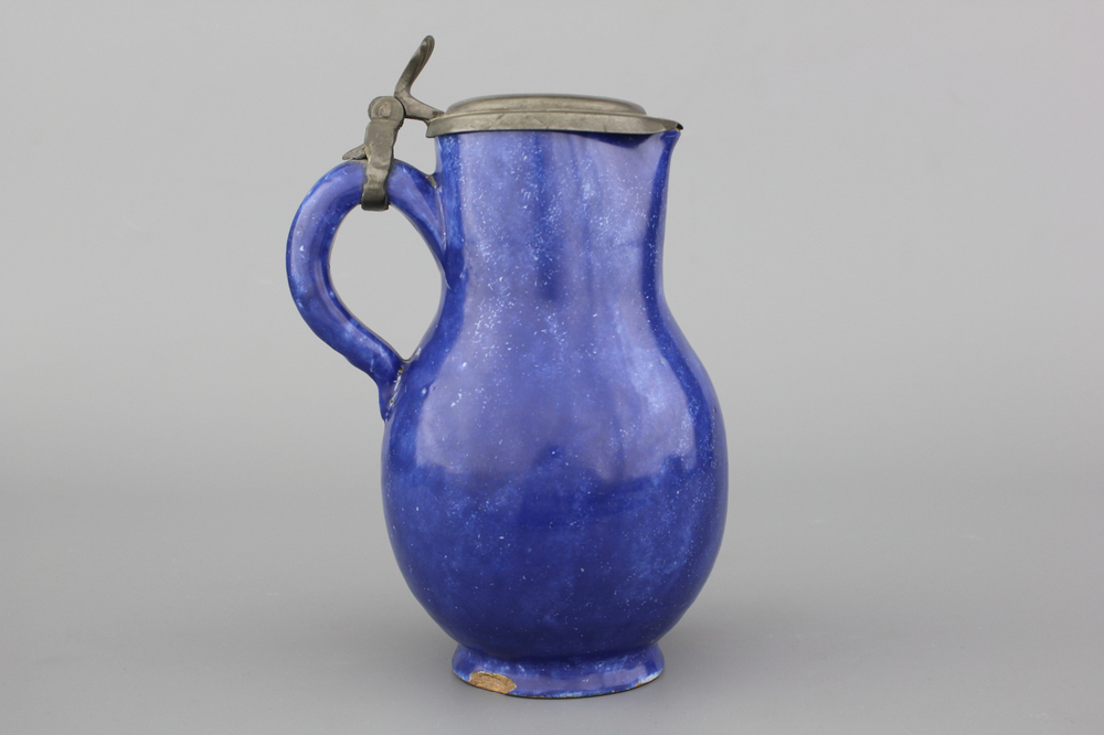A Brussels faience monochrome blue pewter-mounted jug, 18th C.