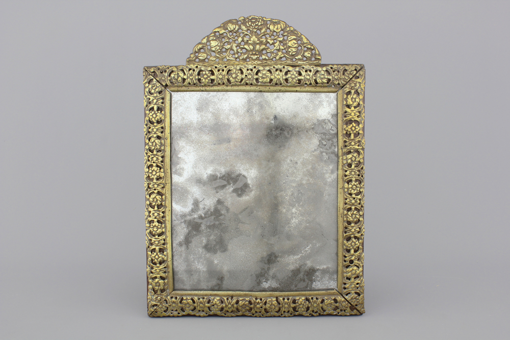 A Louis XIII gilt brass frame mirror, 17th C.