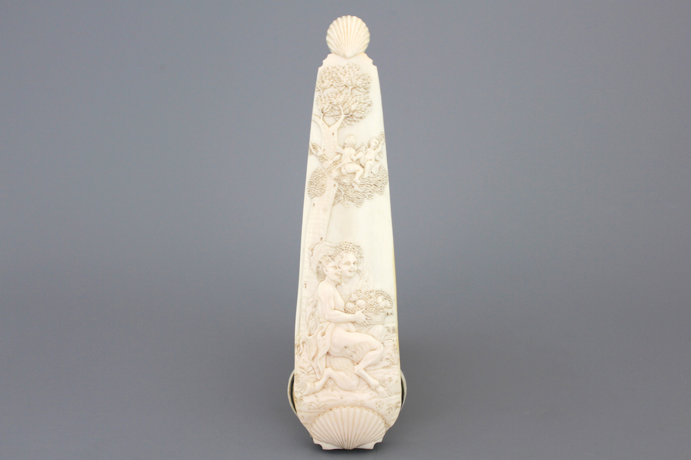 A carved ivory tobacco rasp depicting Satyr with a nymph, Dieppe, early 18th C.