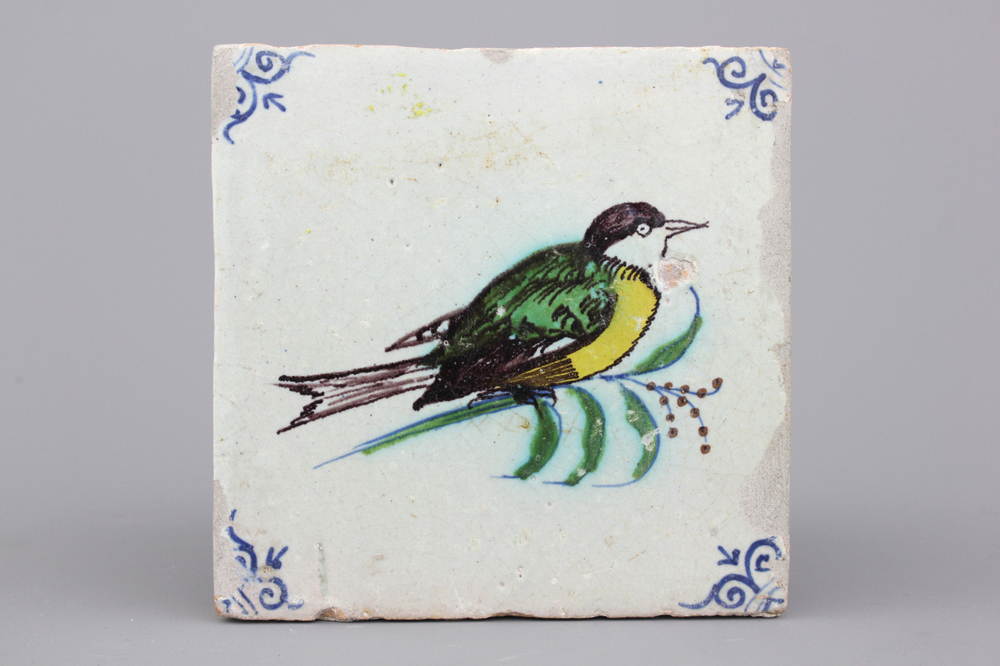 A polychrome Dutch Delft tile with a bird, 17th C.