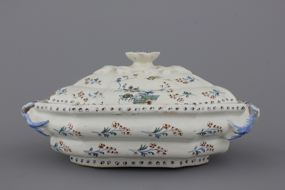 A Brussels fa&iuml;ence tureen and cover, decor &quot;A l'haie fleurie&quot;, 18th C.