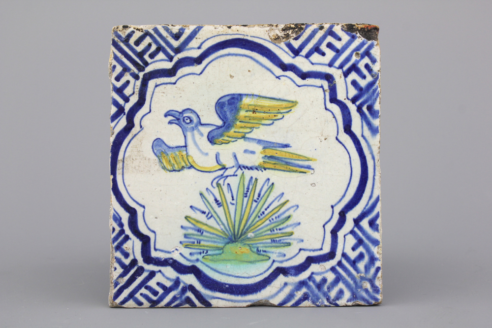 A polychrome Dutch Delft tile with a bird, 17th C.