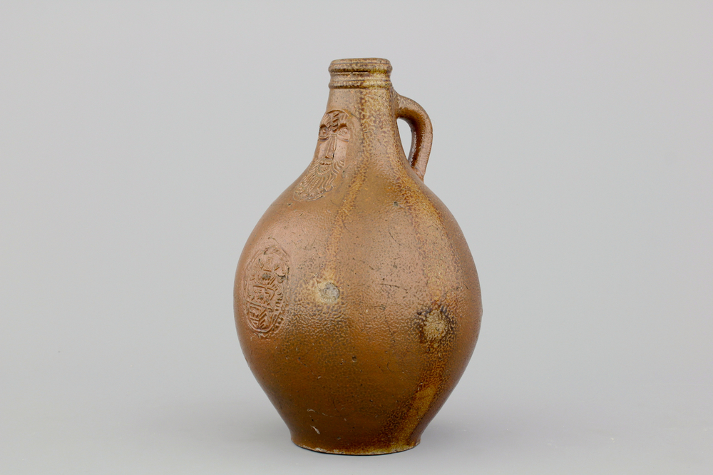 A German stoneware bellarmine jug, 17th C.