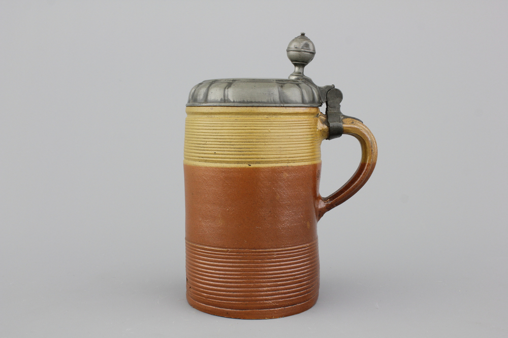 A German stoneware pewter-mounted beer stein, 18th C.