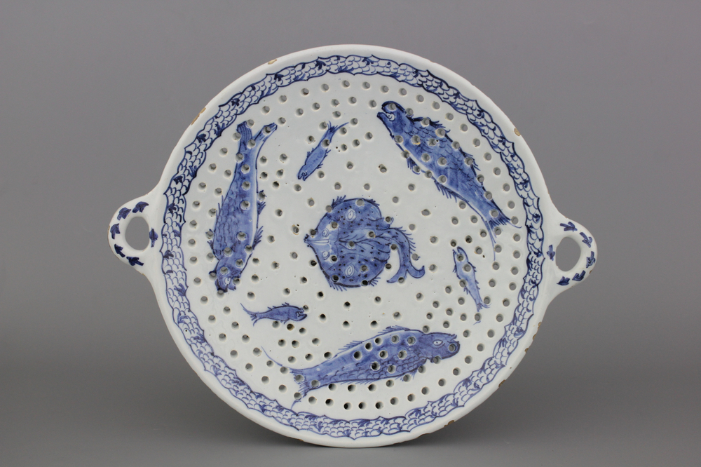 A large Dutch Delft blue and white fish strainer, 18th C.