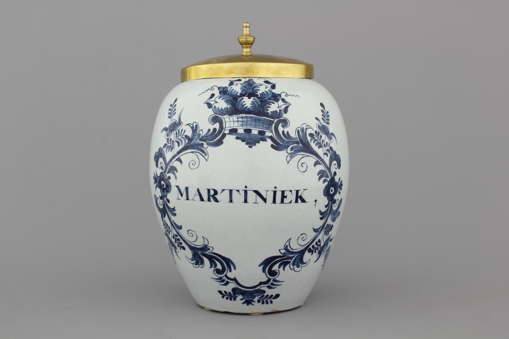 A Dutch Delft tobacco jar with brass lid, &quot;Martiniek&quot; 18th C.