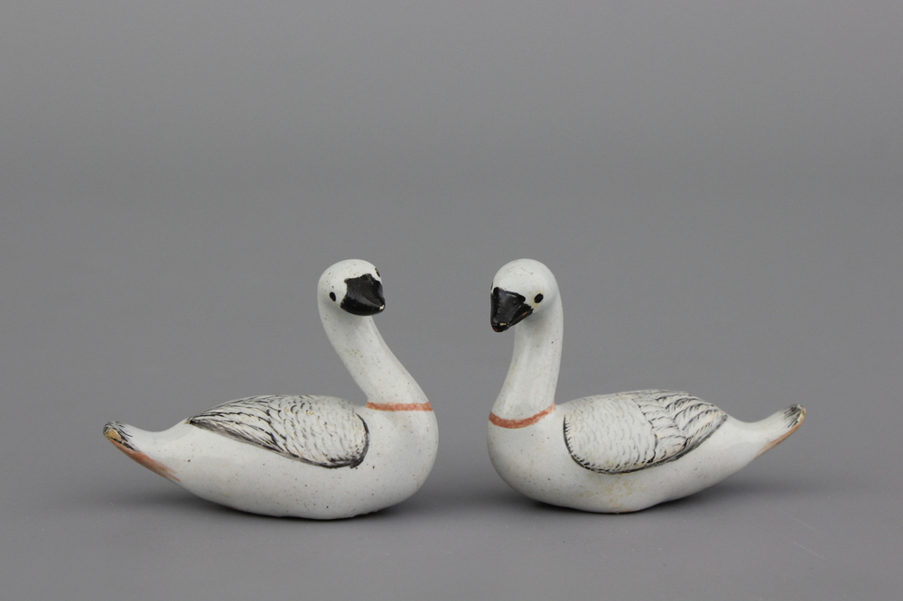 A pair of small Dutch Delft black-enhanced models of swans, 18th C.