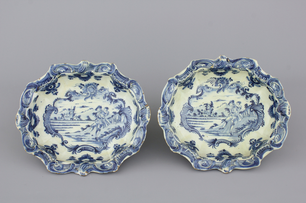 A pair of Dutch Delft blue and white saladiers with a trumpet player, 18th C.