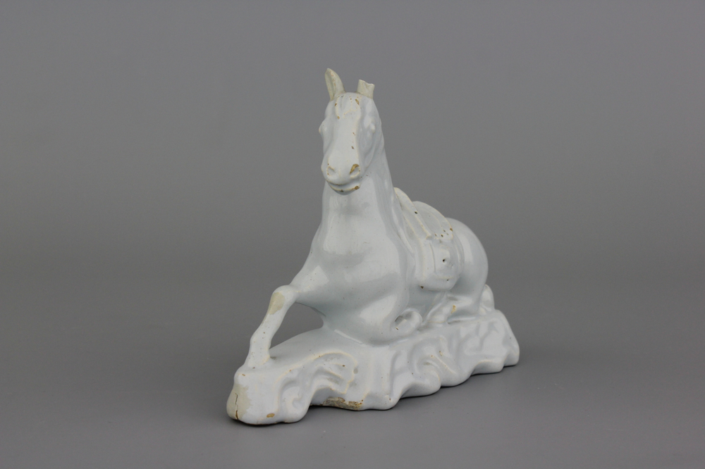 A white Delft model of a recumbent horse, 18th C.