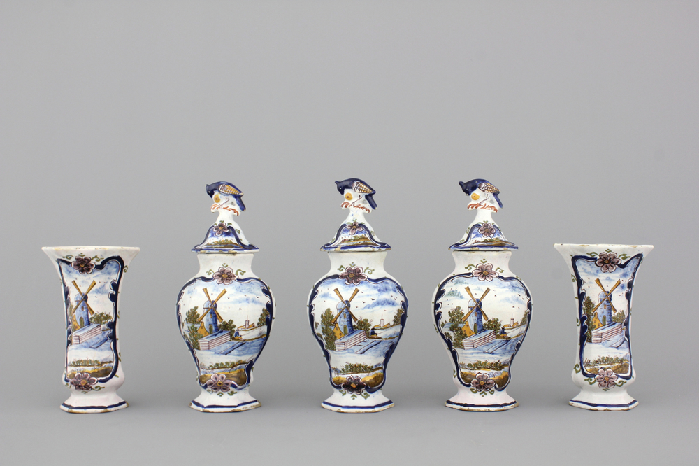A Dutch Delft polychrome garniture with windmills, end of the 18th C.