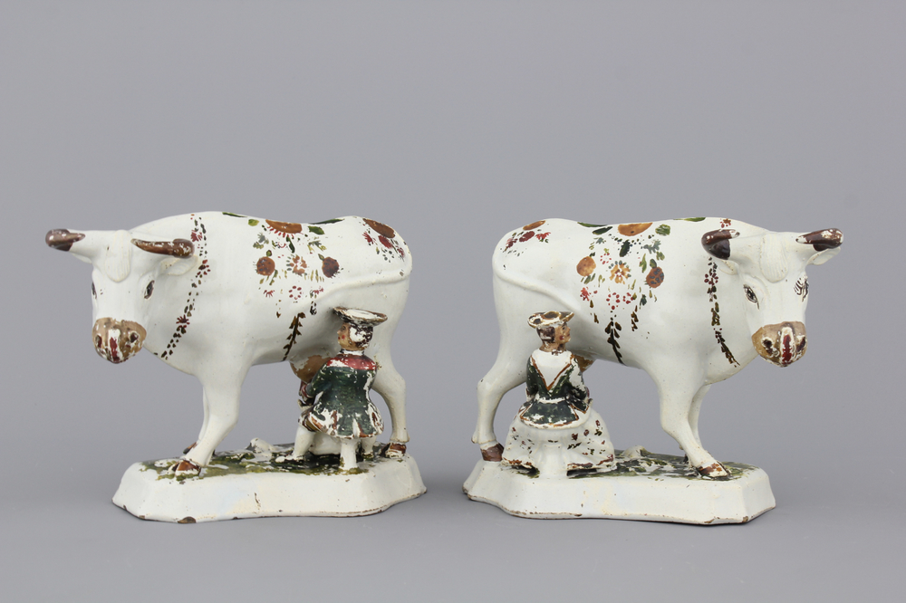 A pair of white Delft cold-painted milking groups, 18th C.