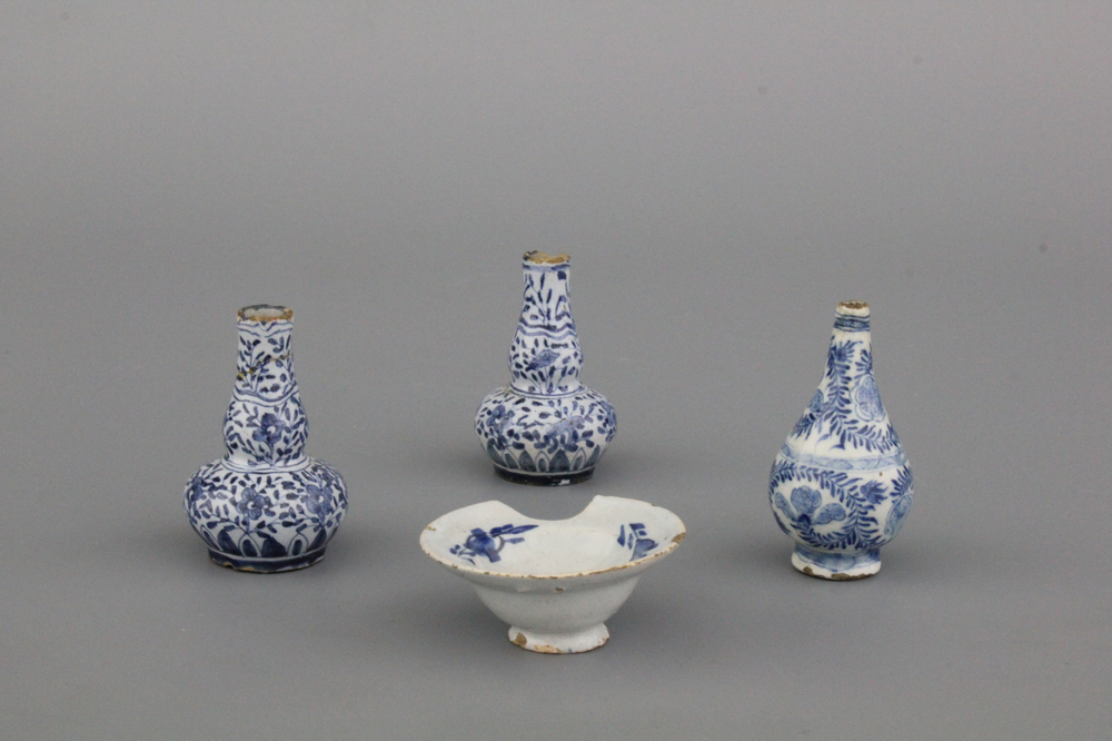 A group of Dutch Delft blue and white miniature vases and a shaving bowl, 18th C.