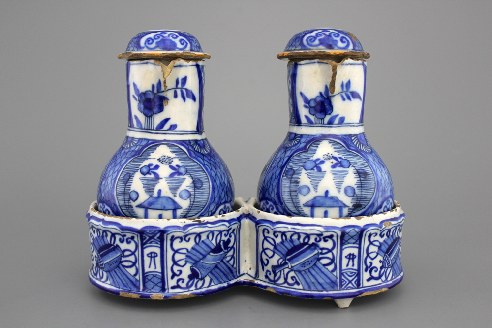 A Dutch Delft blue and white chinoiserie cruet set, 18th C.