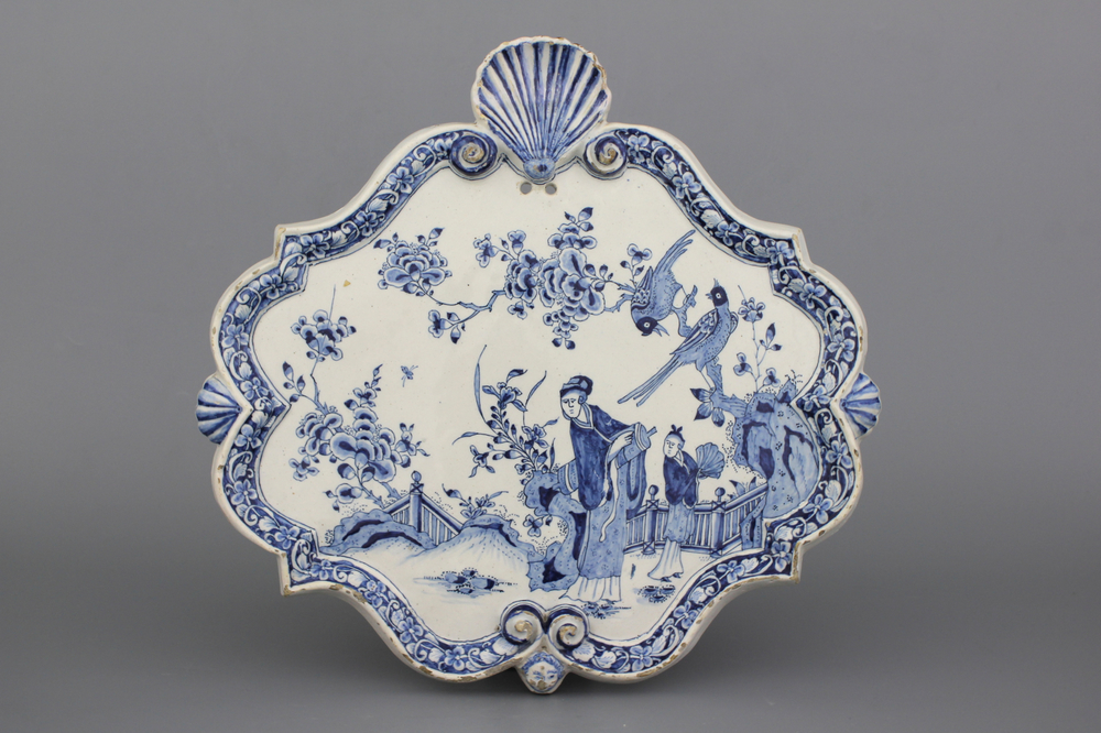 A large Dutch Delft blue and white chinoiserie plaque, 18th C.