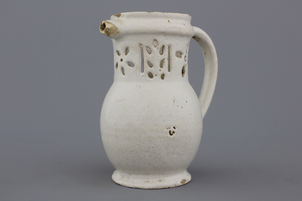 A white Delft puzzle jug, late 17th C.