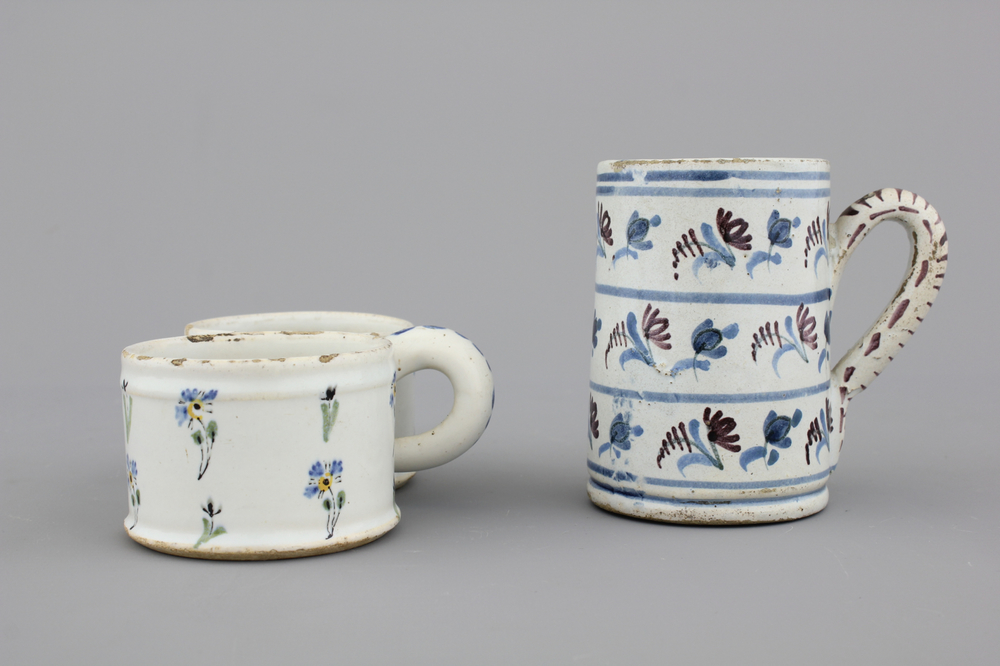 A French faience tankard and a cruet set stand, 18th C.