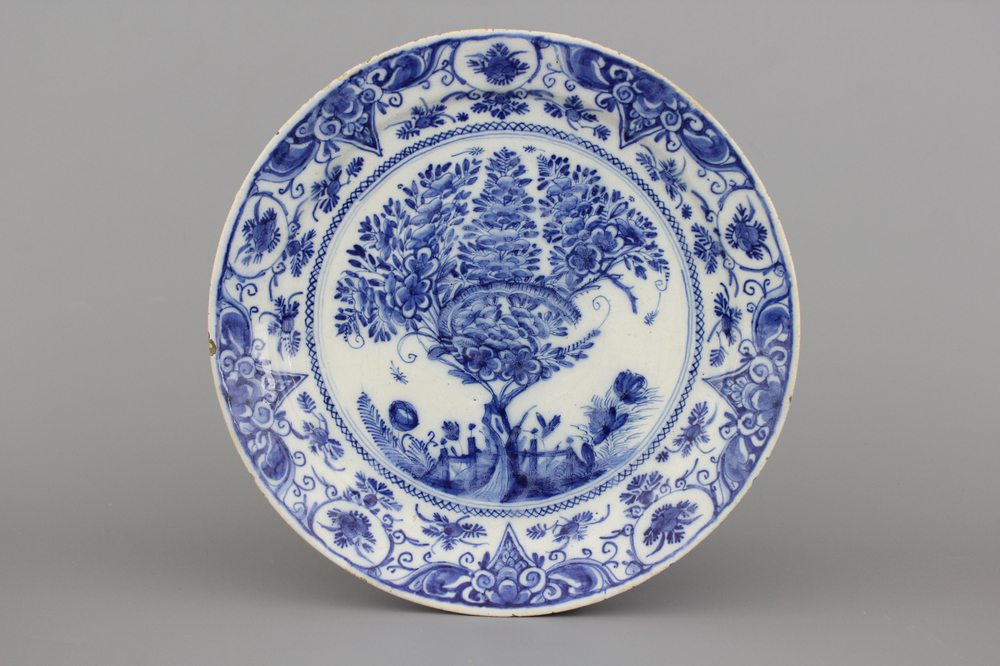 A fine Dutch Delft blue and white &quot;Tea tree&quot; pancake plate, ca. 1700