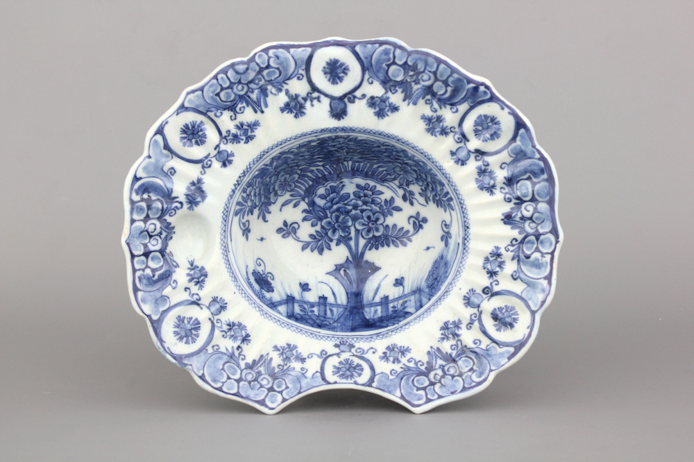 A Dutch Delft blue and white &quot;tea tree&quot; pattern barber's bowl, 18th C.