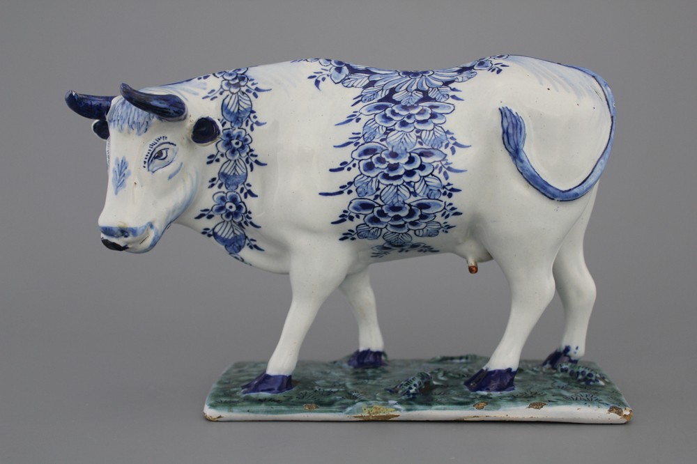 A Dutch Delft model of a cow, 18th C.