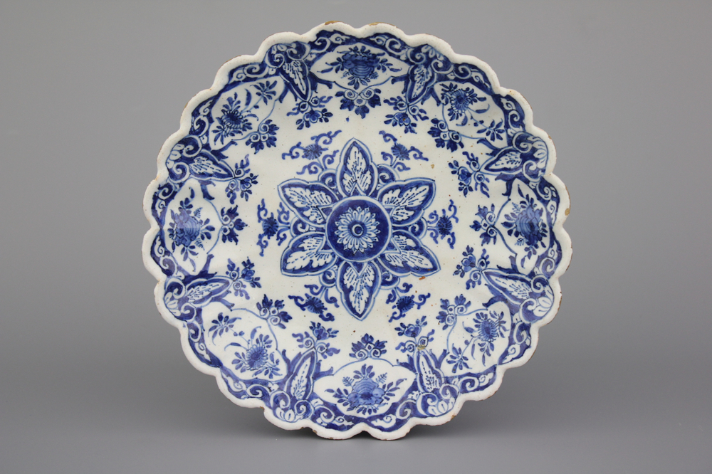 A Dutch Delft blue and white fluted chinoiserie plate, ca. 1700