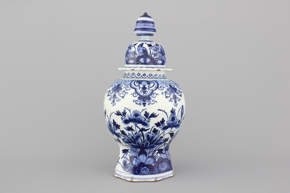 A Dutch Delft blue and white baluster vase and cover, 18th C.