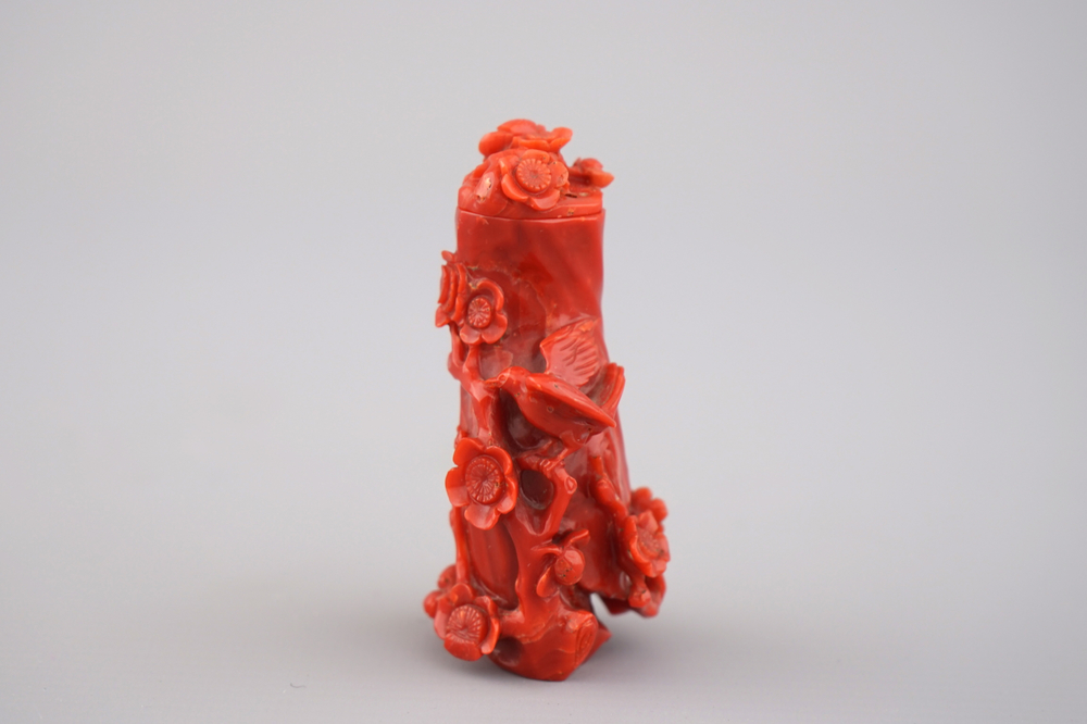A Chinese carved dark red coral snuff bottle