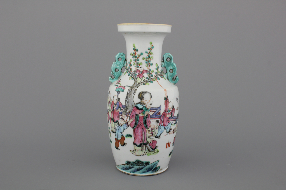 A Chinese porcelain famille rose vase with a garden scene, 19th C.