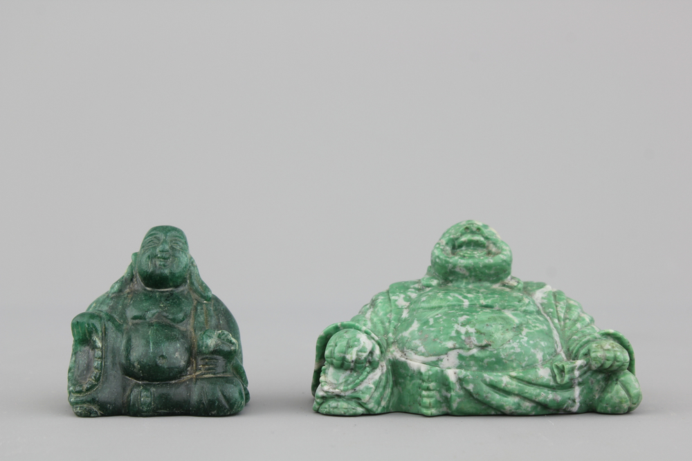 Two Chinese carved green hardstone figures of buddha, 20th C.