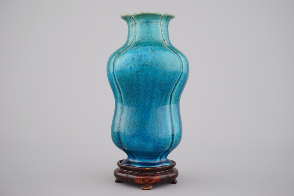 An unusual Chinese turquoise monochrome vase on carved wood stand, 18th C.