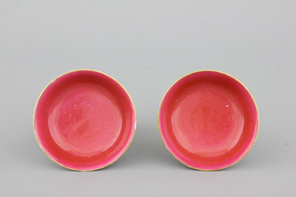 A pair of Chinese porcelain small ruby ground dishes, Guangxu mark and of the period