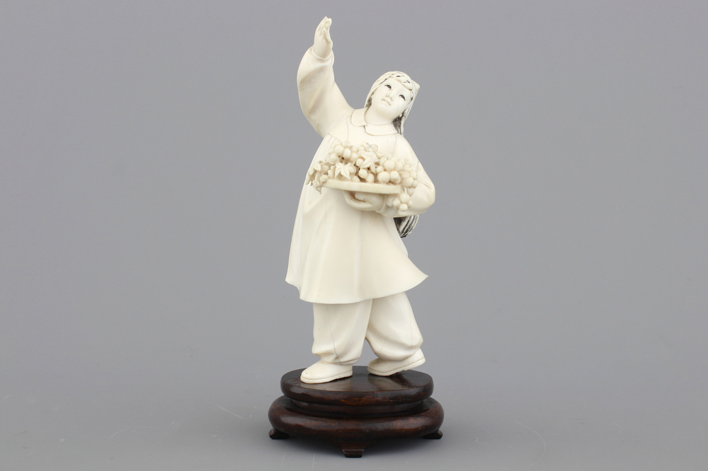 A fine Chinese Cultural Revolution carved ivory figure of a girl