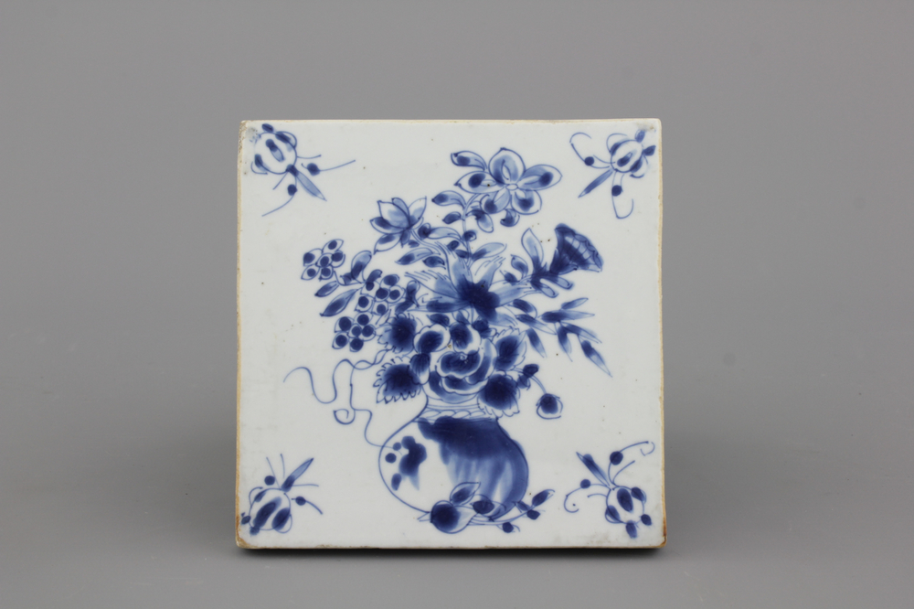 A Chinese porcelain blue and white tile with a flower vase, Ming dynasty, 16/17th C.