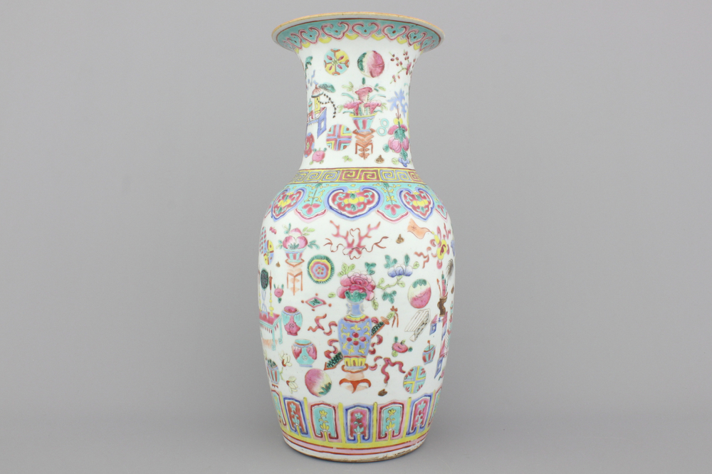 A Chinese porcelain famille rose vase with a decoration of scholar's objects, 19th C.