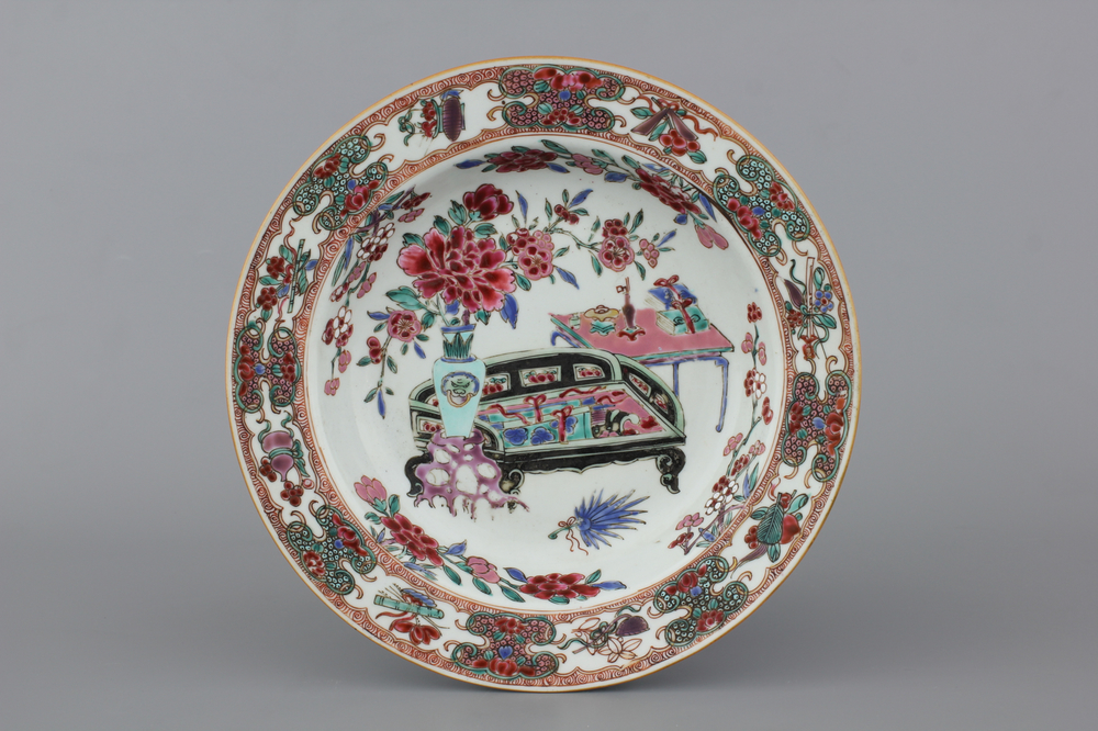A Chinese porcelain famille rose plate with an interior, Yongzheng, 18th C.