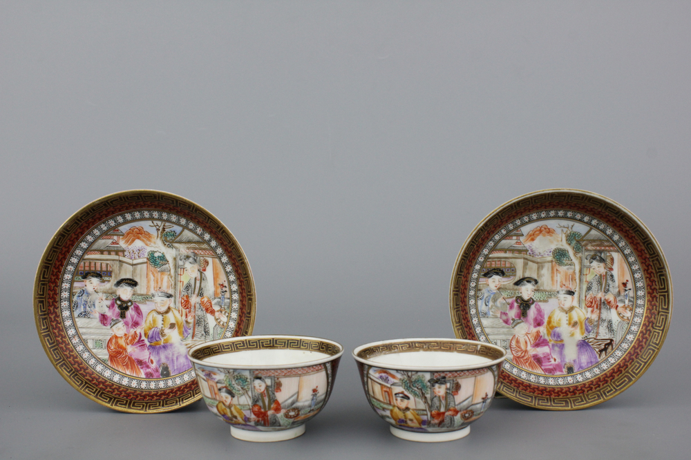A pair of Chinese porcelain famille rose mandarin cups and saucers, Qianlong, 18th C.