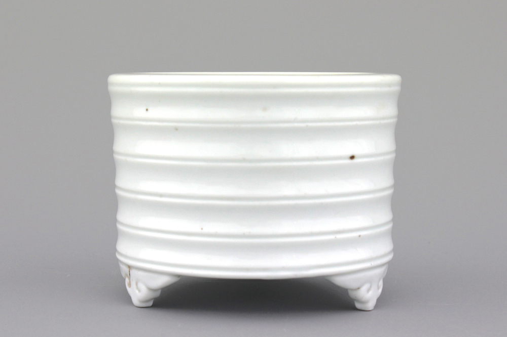 A blanc de Chine cylindrical censer on four feet, 19th C.
