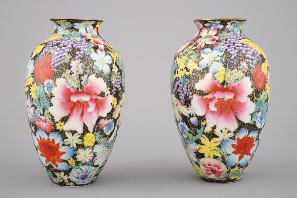 A pair of Chinese porcelain millefleurs black ground vases, ca. 1900