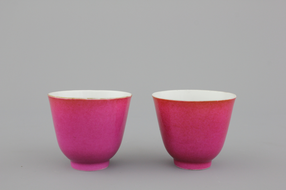 A pair of Chinese porcelain ruby ground wine cups, 19th C.