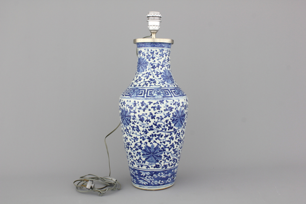A Chinese porcelain blue and white vase with lotus scrolls, mounted as lamp, 19th C.