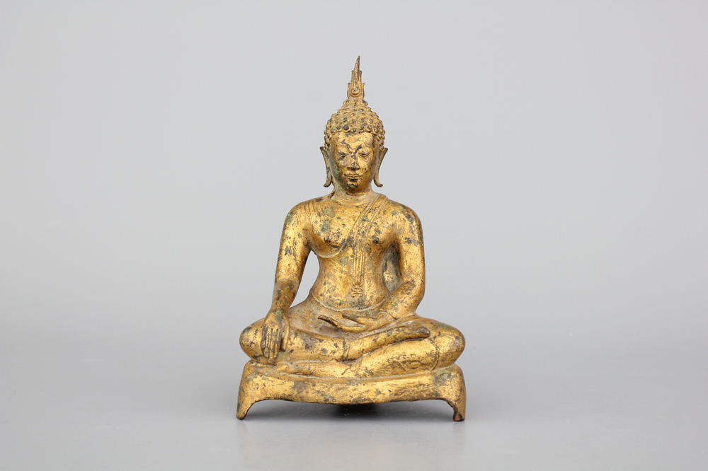 A Thai gilt bronze figure of a seated Buddha, 19th C.