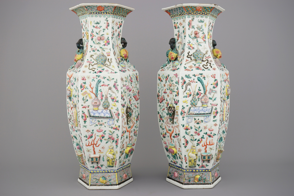 A fine pair of Chinese famille rose relief-decorated hexagonal vases, 19th C.